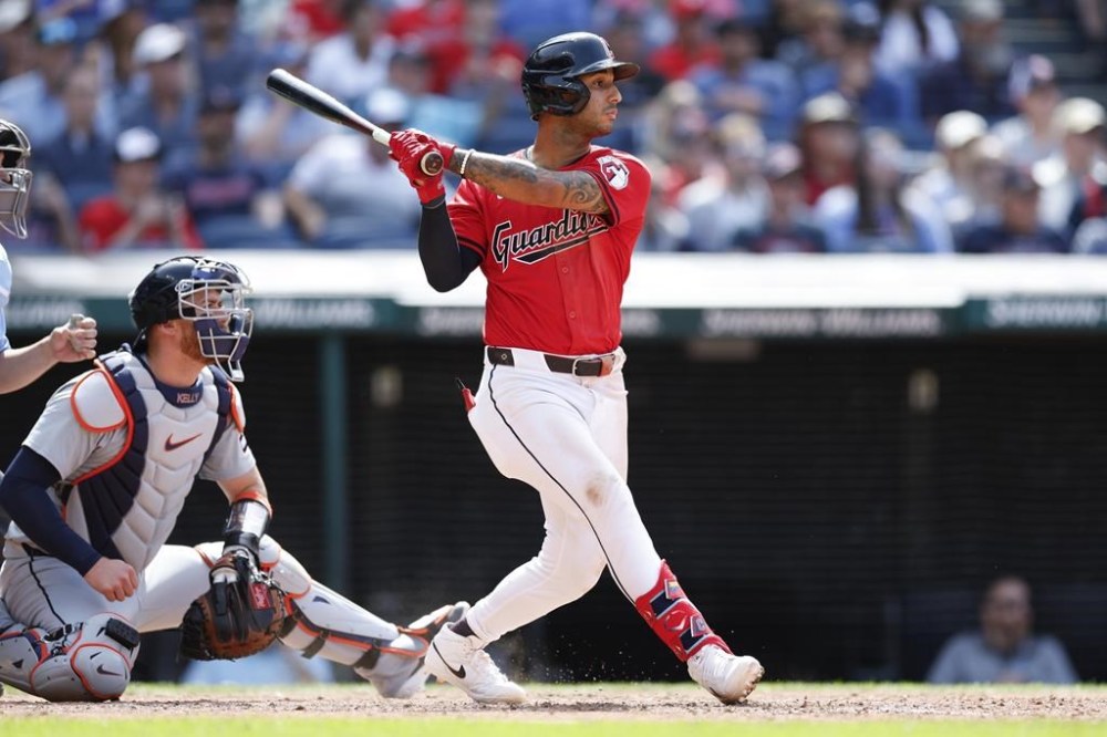 Cleveland Guardians' Brayan Rocchio hits the game-winning RBI single off Detroit Tigers pitcher Alex Lange in the 10th inning of a baseball game, Wednesday, May 8, 2024, in Cleveland. (AP Photo/Ron Schwane)