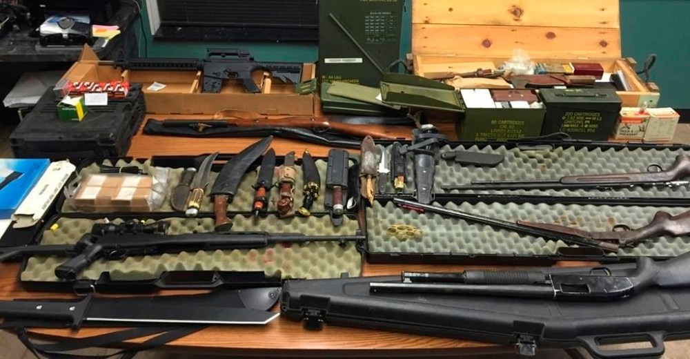 FILE - This undated photo provided by the Van Buren County Sheriff's Office in Paw Paw, Mich., shows stolen guns, ammunition and knives that were recovered Sept. 12, 2015, in Antwerp Township, Mich. The rate of guns stolen from cars in the U.S. has tripled over the last decade, making them the largest source of stolen guns in the country, a new analysis of FBI data by the gun-safety group Everytown found. (Van Buren County Sheriff's Office via AP)