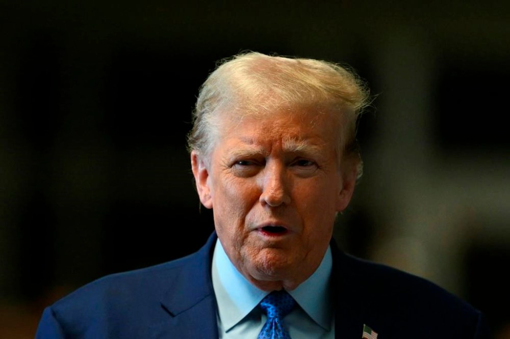 Former President Donald Trump speaks to reporters at Manhattan Criminal Court in New York, Thursday, May 9, 2024. (Angela Weiss/Pool Photo via AP)