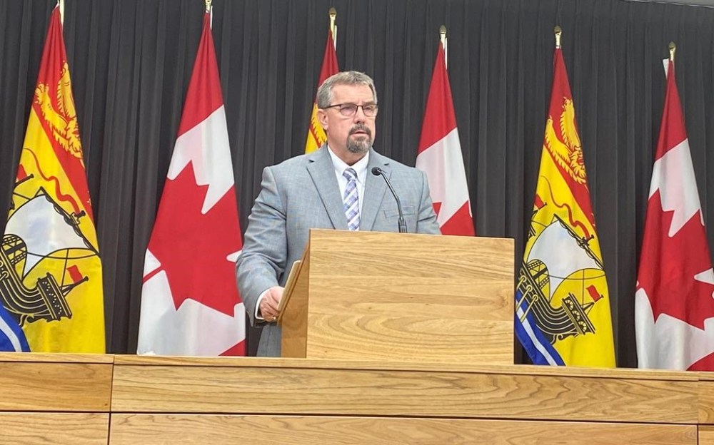 New Brunswick Education and Early Childhood Development Minister Bill Hogan addresses a news conference in Fredericton, Thursday, Dec.15, 2022. Hogan says his threat to dissolve school districts that don’t adhere to the province’s policy change affecting LGBTQ students also extends to francophone school boards. THE CANADIAN PRESS/Hina Alam