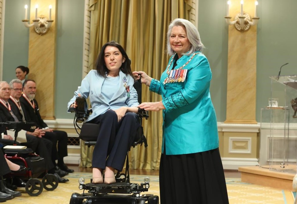 Maayan Ziv, founder of AccessNow, is presented with the Meritorious Service Cross by Governor General Mary Simon during a ceremony at Rideau Hall in Ottawa, on Wednesday, May 8, 2024. THE CANADIAN PRESS/ Patrick Doyle