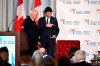 Perrin Beatty, president of the Canadian Chamber of Commerce, points Prime Minister Justin Trudeau to his seat for a fireside discussion, after Trudeau's remarks at the Canadian Chamber of Commerce Hill Day in Ottawa, on Monday, April 15, 2024. Prominent business groups are backtracking their claim that one in five Canadians will be affected by federal government's proposed changes to capital gains taxation. THE CANADIAN PRESS/Justin Tang