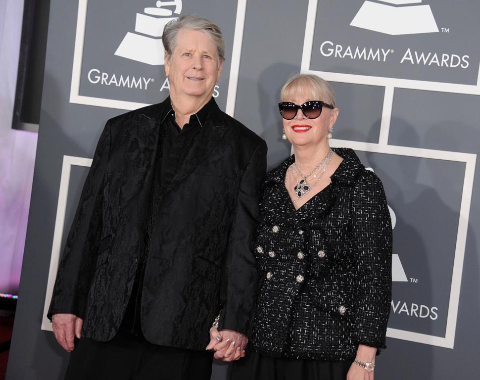 Musician Brian Wilson, left, and his wife Melinda Ledbetter Wilson arrive at the 55th annual Grammy Awards on Sunday, Feb. 10, 2013, in Los Angeles. (Photo by Jordan Strauss/Invision/AP, File)