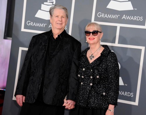 FILE - Musician Brian Wilson, left, and his wife Melinda Ledbetter Wilson arrive at the 55th annual Grammy Awards on Sunday, Feb. 10, 2013, in Los Angeles. A judge found Thursday that Beach Boys founder and music luminary Brian Wilson should be in a court conservatorship to manage his personal and medical decisions because of what his doctor calls a “major neurocognitive disorder.” (Photo by Jordan Strauss/Invision/AP, File)