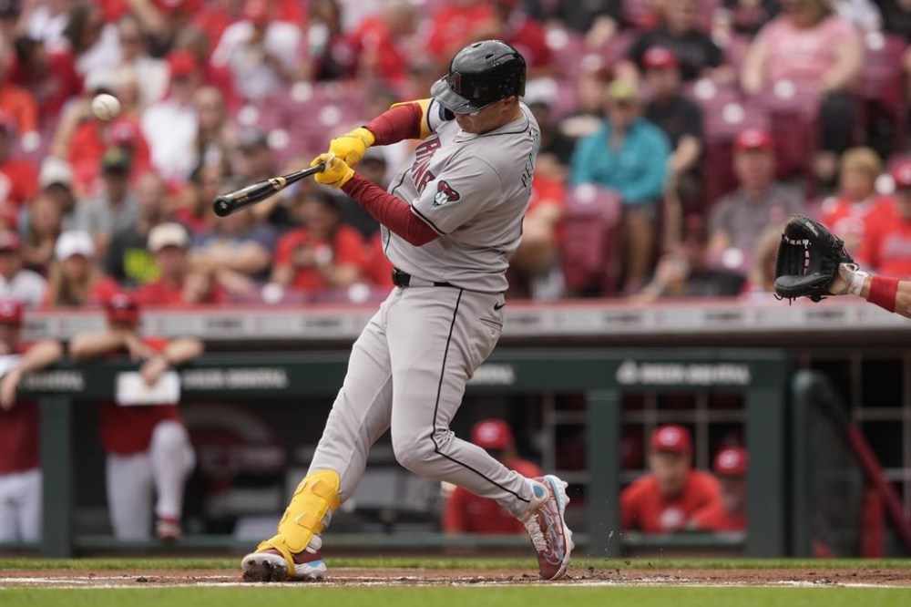 Arizona Diamondbacks' Joc Pederson hits a home run in the first inning of a baseball game against the Cincinnati Reds on Thursday, May 9, 2024, in Cincinnati. (AP Photo/Carolyn Kaster)