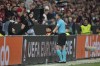 Referee Danny Makkeliececks the VAR during the Europa League second leg semi-final soccer match between Leverkusen and Roma at the BayArena in Leverkusen, Germany, Thursday, May 9, 2024. (AP Photo/Matthias Schrader)