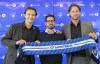 CF Montreal President and Chief Executive Officer Gabriel Gervais, left, Vice-President and Chief Sporting Officer Olivier Renard, right, and Hernan Losada hold up CF Montreal scarf following a news conference in Montreal, Thursday, December 22, 2022. CF Montreal is parting ways with Renard, the Major League Soccer club announced Thursday.  THE CANADIAN PRESS/Graham Hughes