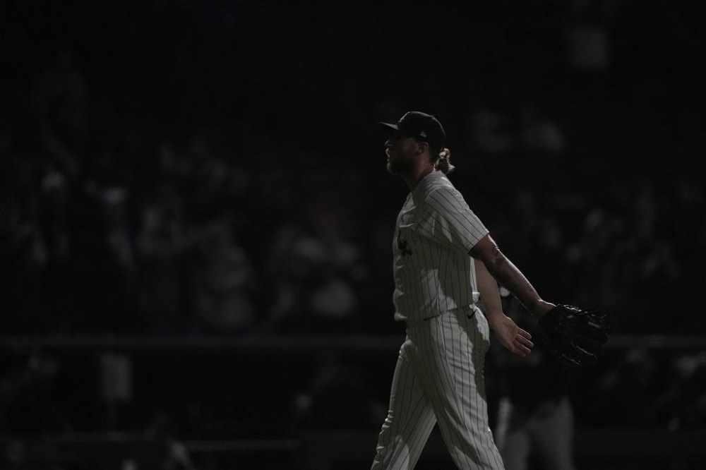 Chicago White Sox pitcher Michael Kopech begins to celebrate as the stadium lights flash after the team's 3-2 win over the Cleveland Guardians in a baseball game Thursday, May 9, 2024, in Chicago. (AP Photo/Charles Rex Arbogast)