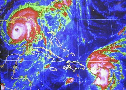 FILE - Hurricane Ivan seen on the computer screen at the National Hurricane Center in Miami, Wednesday, Sept. 15, 2004 seen 250 miles from the Gulf Coast and Tropical Storm Jeanne is seen as approaches Puerto Rico. The top U.S. officials in the business of predicting, preparing and responding to natural disasters had a message for Floridians on Friday with the start of hurricane season less than a month away: It's not a matter of if a hurricane will hit but when. (AP Photo/J. Pat Carter, File)