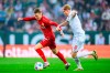 Stuttgart's Chris Fuhrich, left, and Augsburg's Tim Breithaupt in action during the Bundesliga soccer match between FC Augsburg and VfB Stuttgart at WWK-Arena, Augsburg, Germany, Friday May 10, 2024. (Tom Weller/dpa via AP)