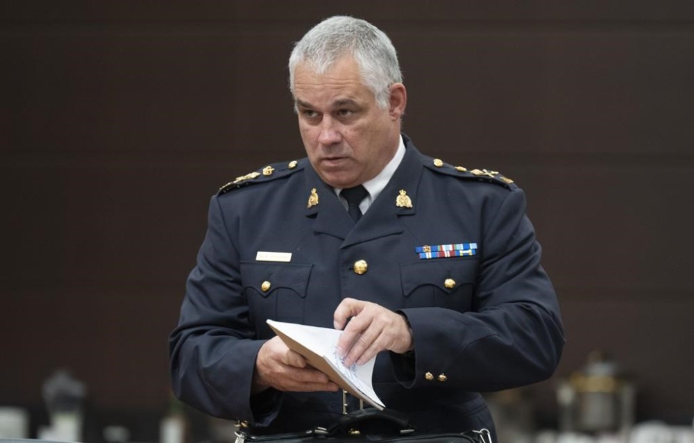 Acting RCMP Commissioner Mike Duheme waits to appear before the Procedure and House Affairs committee, in Ottawa, Tuesday, June 13, 2023. THE CANADIAN PRESS/Adrian Wyld