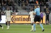 Portland Timbers midfielder Diego Chara, center, gets a red card and is ejected after fouling Los Angeles FC midfielder Eduard Atuesta during the second half of an MLS soccer match Saturday, April 27, 2024, in Los Angeles. (AP Photo/Marcio Jose Sanchez)