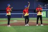 Canadian cricket team captain Saad Bin Zafar waves as he's flanked by teammates Nicholas Kirton, left, and Jeremy Gordon, right, after throwing out the first pitch at the Toronto Blue Jays game against the Minnesota Twins in Toronto on Friday, May 10, 2024. THE CANADIAN PRESS/Cole Burston