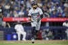 Minnesota Twins' Carlos Santana (30) watches the ball fly as he hits a solo home run against the Toronto Blue Jays during fifth inning MLB baseball action in Toronto on Friday, May 10, 2024. THE CANADIAN PRESS/Cole Burston