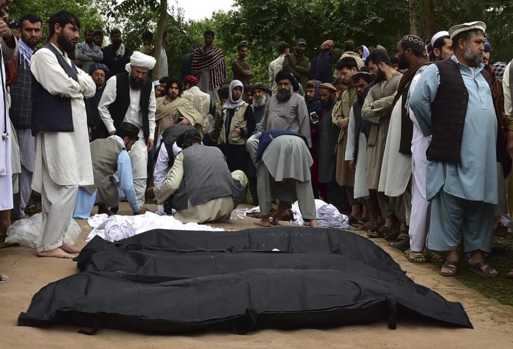 Dead bodies of Afghan people are placed on the ground after heavy flooding in Baghlan province in northern Afghanistan Saturday, May 11, 2024. Flash floods from seasonal rains in Baghlan province in northern Afghanistan killed dozens of people on Friday, a Taliban official said. (AP Photo/Mehrab Ibrahimi)