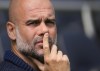 Manchester City's head coach Pep Guardiola waits for the start of the English Premier League soccer match between Fulham and Manchester City at the Craven Cottage Stadium in London, Saturday, May 11, 2024. (AP Photo/Kirsty Wigglesworth)