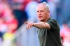 Freiburg's head coach Christian Streich points during German Bundesliga soccer match between SC Freiburg and 1. FC Heidenheim in Freiburg, Germany, Saturday, May 11, 2024. (Tom Weller/dpa via AP)