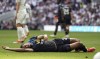 Burnley's Lorenz Assignon reacts after a challenge during the English Premier League soccer match between Tottenham Hotspur and Burnley, at the Tottenham Hotspur Stadium, London, Saturday May 11, 2024. (Adam Davy/PA via AP)