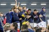 Kiel players celebrate promotion after the German second division match between Holstein Kiel and VfL Fortuna Düsseldorf, Saturday, May 11, 2024, at Holstein Stadium in Kiel, Germany. (Axel Heimken/dpa via AP)