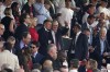 Labour Party leader Kier Starmer, right, gestures with Britain's former athlete Sebastian Coe on the tribune prior to the start of the English Premier League soccer match between Manchester United and Arsenal at the Old Trafford Stadium in Manchester, England, Sunday, May 12, 2024. (AP Photo/Dave Thompson)