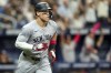 New York Yankees' Aaron Judge watches his two-run home run against the Tampa Bay Rays during the fifth inning of a baseball game Sunday, May 12, 2024, in St. Petersburg, Fla. (AP Photo/Mike Carlson)