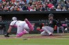 Arizona Diamondbacks catcher Tucker Barnhart, right, slides into home plate as Baltimore Orioles catcher James McCann, left, tries to block during a baseball game Sunday, May 12, 2024, in Baltimore. (AP Photo/Jose Luis Magana)