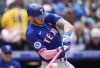 Texas Rangers' Jonah Heim grounds out against Colorado Rockies starting pitcher Ty Blach in the fourth inning of a baseball game Sunday, May 12, 2024, in Denver. (AP Photo/David Zalubowski)