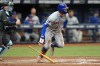 New York Mets' Brandon Nimmo follows his RBI single off Tampa Bay Rays relief pitcher Kevin Kelly scores Brett Baty during the fourth inning of a baseball game Sunday, May 5, 2024, in St. Petersburg, Fla. (AP Photo/Chris O'Meara)