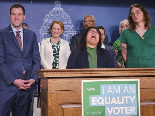 Democratic Minnesota state Rep. Kaohly Her, of St. Paul, the lead House author of a proposed state Equal Rights Amendment, interacts with reporters during a news conference Monday, May 13, 2024 at the State Capitol in St. Paul, Minn. Impassioned supporters and opponents of a far-reaching Equal Rights Amendment to the Minnesota Constitution flocked to the State Capitol ahead of crucial votes aimed at putting it on the 2026 ballot. (AP Photo/Steve Karnowski)