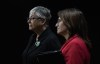 Metis Nation of Ontario President Margaret Froh, left, and 
Metis Nation of Alberta President Andrea Sandmaier listen to a question during a news conference, Wednesday, Oct. 25, 2023. THE CANADIAN PRESS/Adrian Wyld