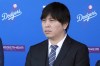 FILE - Interpreter Ippei Mizuhara listens during a baseball news conference at Dodger Stadium, Thursday, Dec. 14, 2023, in Los Angeles. Mizuhara, the former interpreter for Los Angeles Dodgers star Shohei Ohtani, is expected to plead not guilty Tuesday, May 14, 2024, to bank and tax fraud, a formality ahead of a deal he has negotiated with federal prosecutors in a sports betting case. (AP Photo/Marcio Jose Sanchez, File)