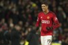 FILE - Manchester United's Raphael Varane celebrates on the full time during the English Premier League soccer match between Manchester United and Aston Villa at the Old Trafford stadium in Manchester, England, on Dec. 26, 2023. Former France center back Raphael Varane will leave Manchester United when his contract expires at the end of the season. The 31-year-old Varane joined United in 2021 but has struggled to reproduce the kind of form he showed in a trophy-laden, decade-long spell at Real Madrid before that. Injuries have also played a part and restricted Varane to 93 appearances in his three seasons at United. (AP Photo/Dave Thompson, File)