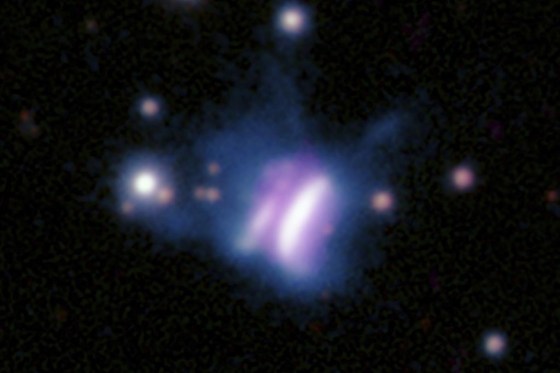 This composite radio and optical image shows IRAS 23077, center, a planet-forming disk, and several surrounding stars. (Radio: SAO/ASIAA/SMA/K. Monsch et al; Optical: Pan-STARRS via The Associated Press)