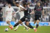 Tottenham's Rodrigo Bentancur, second left, and =Manchester City's Manuel Akanji challenge for the ball during the English Premier League soccer match between Tottenham Hotspur and Manchester City at Tottenham Hotspur Stadium in London, Tuesday, May 14, 2024.(AP Photo/Kin Cheung)