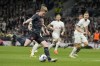 Manchester City's Kevin De Bruyne passes the ball to Manchester City's Erling Haaland during the English Premier League soccer match between Tottenham Hotspur and Manchester City at Tottenham Hotspur Stadium in London, Tuesday, May 14, 2024.(AP Photo/Kin Cheung)