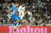 Real Madrid's Jude Bellingham, right, scores his side's opening goal during the Spanish La Liga soccer match between Real Madrid and Deportivo Alaves at the Santiago Bernabeu stadium in Madrid, Spain, Tuesday, May 14, 2024. (AP Photo/Jose Breton)