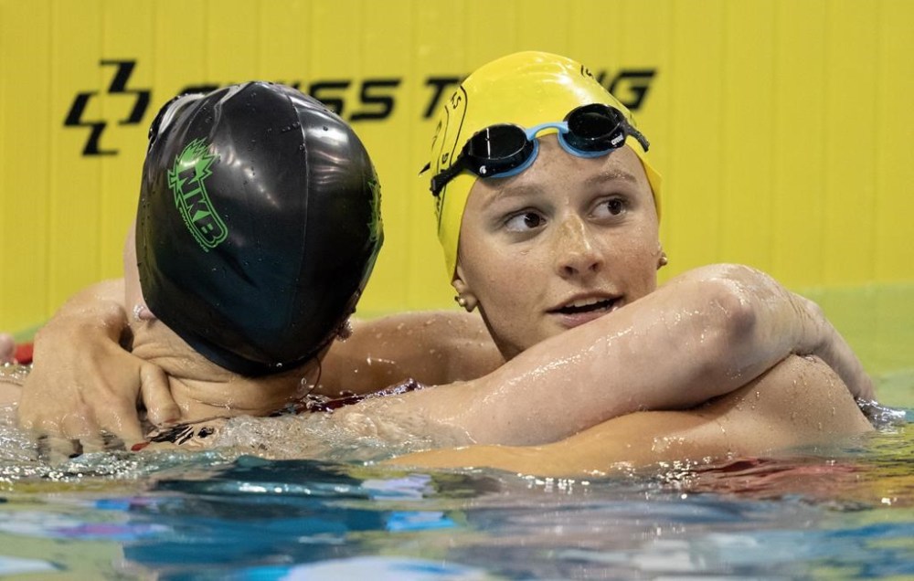 Summer McIntosh hugs Julie Brousseau after winning the women's 200m freestyle at the Canadian Olympic Swim Trials in Toronto on Tuesday May 14, 2024. THE CANADIAN PRESS/Frank Gunn