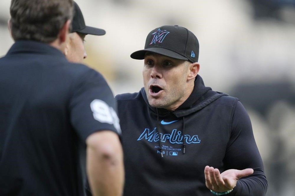 Miami Marlins manager Skip Schumaker argues with the umpires during the second inning of a baseball game against the Detroit Tigers, Tuesday, May 14, 2024, in Detroit. (AP Photo/Carlos Osorio)