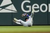 A ball hit for an RBI double by Atlanta Braves' Matt Olson gets past Chicago Cubs outfielder Seiya Suzuki in the first inning of a baseball game Tuesday, May 14, 2024, in Atlanta. (AP Photo/John Bazemore)