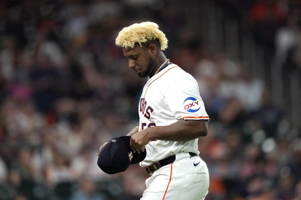 Houston Astros starting pitcher Ronel Blanco leaves the field after being ejected following a foreign substance check during the fourth inning of a baseball game against the Oakland Athletics Tuesday, May 14, 2024, in Houston. (AP Photo/David J. Phillip)