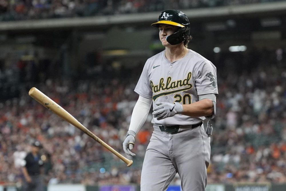 Oakland Athletics' Zack Gelof tosses his bat after striking out during the first inning of a baseball game against the Houston Astros Tuesday, May 14, 2024, in Houston. (AP Photo/David J. Phillip)