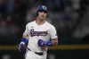 Texas Rangers' Nathaniel Lowe rounds the bases after hitting a solo home run against the Cleveland Guardians in the fifth inning of a baseball game, Tuesday, May 14, 2024, in Arlington, Texas. (AP Photo/Tony Gutierrez)
