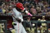 Cincinnati Reds' Elly De La Cruz breaks his bat on an infield grounder against the Arizona Diamondbacks during the sixth inning of a baseball game Tuesday, May 14, 2024, in Phoenix. (AP Photo/Ross D. Franklin)