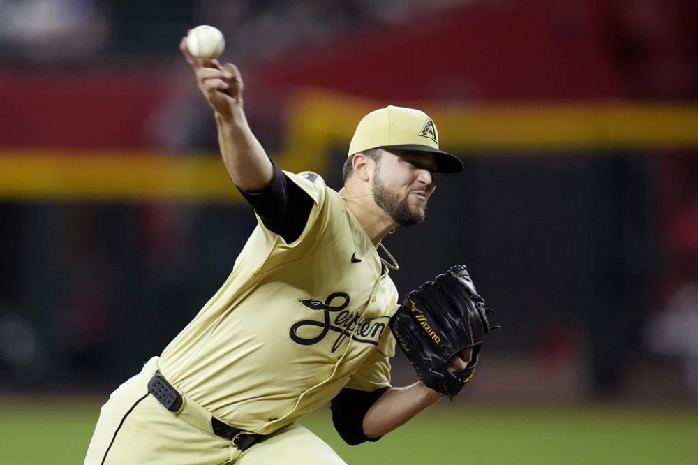 Arizona Diamondbacks starting pitcher Slade Cecconi throws against the Cincinnati Reds during the first inning of a baseball game Tuesday, May 14, 2024, in Phoenix. (AP Photo/Ross D. Franklin)