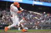 San Francisco Giants' Thairo Estrada shatters his bat while grounding out to Los Angeles Dodgers first baseman Freddie Freeman during the third inning of a baseball game Tuesday, May 14, 2024, in San Francisco. (AP Photo/Godofredo A. Vásquez)