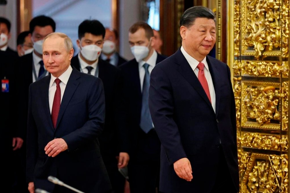 FILE - Russian President Vladimir Putin, left, and Chinese President Xi Jinping enter a hall for their talks at The Grand Kremlin Palace, in Moscow, Russia, on March 21, 2023. Putin says his regime is prepared to negotiate over the conflict in Ukraine in an interview with Chinese media on the eve of visit to partner Beijing that has backed Moscow in its full-scale invasion of its neighbor. (Mikhail Tereshchenko, Sputnik, Kremlin Pool Photo via AP, File)
