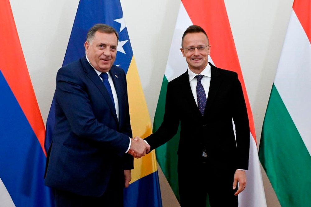Hungarian Minister of Foreign Affairs and Trade Peter Szijjarto, right, receives Bosnian Serb leader serving as the 8th President of Republika Srpska, Milorad Dodik in his office office in Budapest, Hungary, Wednesday, May 15, 2024. (Szilard Koszticsak/MTI via AP)