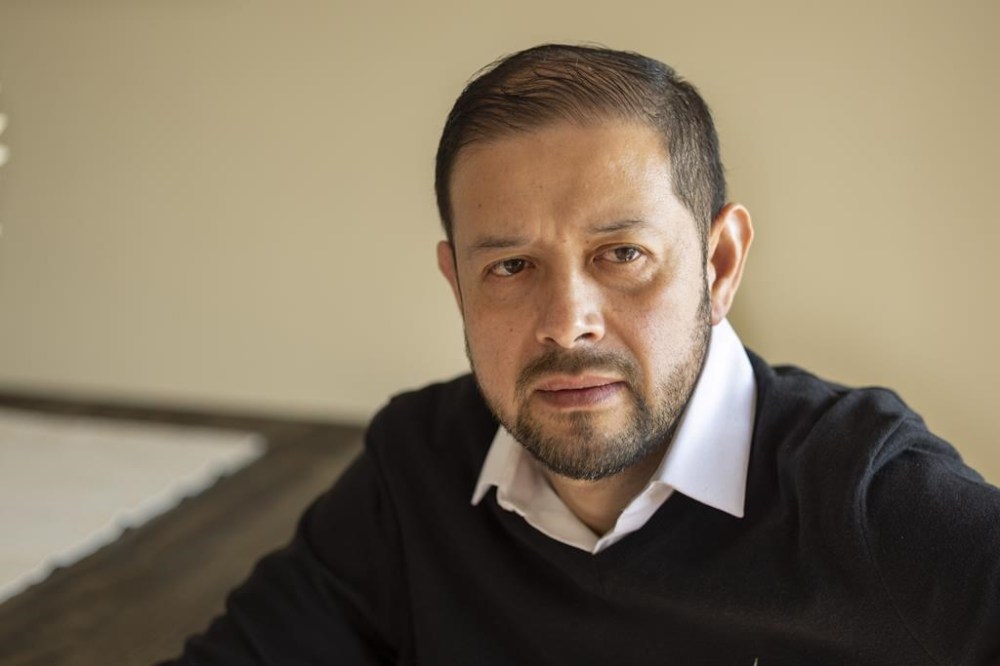 Alex Cruz-Guzman, who in 2015 became a plaintiff in a lawsuit challenging segregation in Minneapolis and St. Paul public schools, poses on Tuesday, May 14, 2024 in Edina, Minn. (AP Photo/Andy Clayton-King)