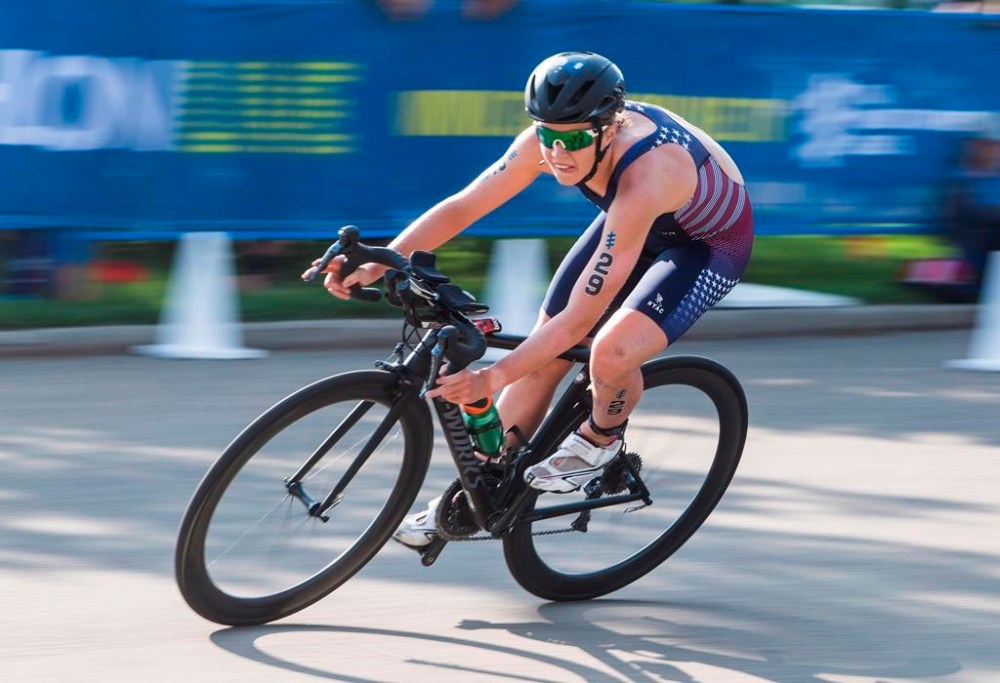FILE - Taylor Knibb, of the United States, rides in the women's elite category of the ITU World Triathlon Series in Edmonton, Alberta, Friday, July 27, 2018. Knibb, an Olympic triathlete, won the women's time trial at the U.S. road cycling championships Wednesday, May 15, 2024, securing her spot on the American team and presenting her with a chance to compete in two different sports at the Paris Games. (Jason Franson/The Canadian Press via AP, File)
