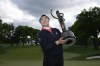Rose Zhang poses for pictures after winning the LPGA Cognizant Founders Cup golf tournament, Sunday, May 12, 2024, in Clifton, N.J. (AP Photo/Seth Wenig)